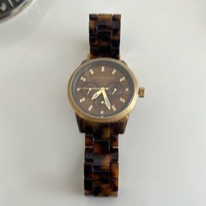 Michael Kors tortoise watch. Like new condition.  Needs new battery.